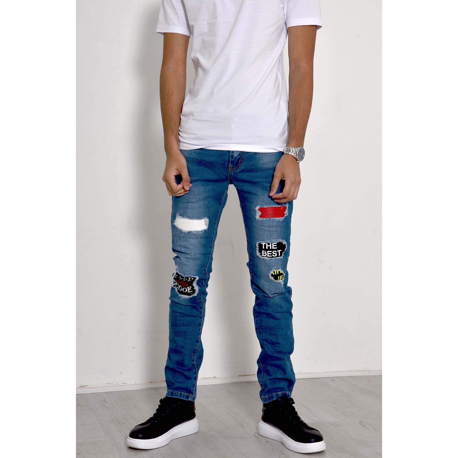 Distressed patched online jeans